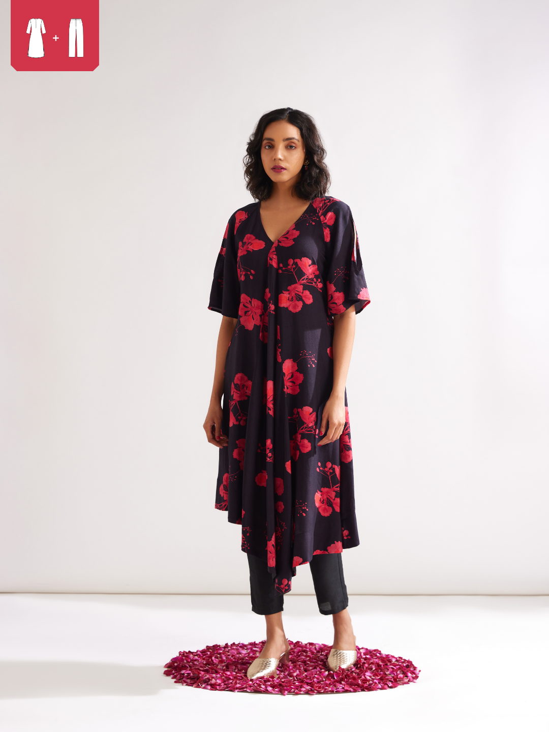 Asymmetrical Gulmohar kurta with cut out sleeves paired with pegged pants- Rich black