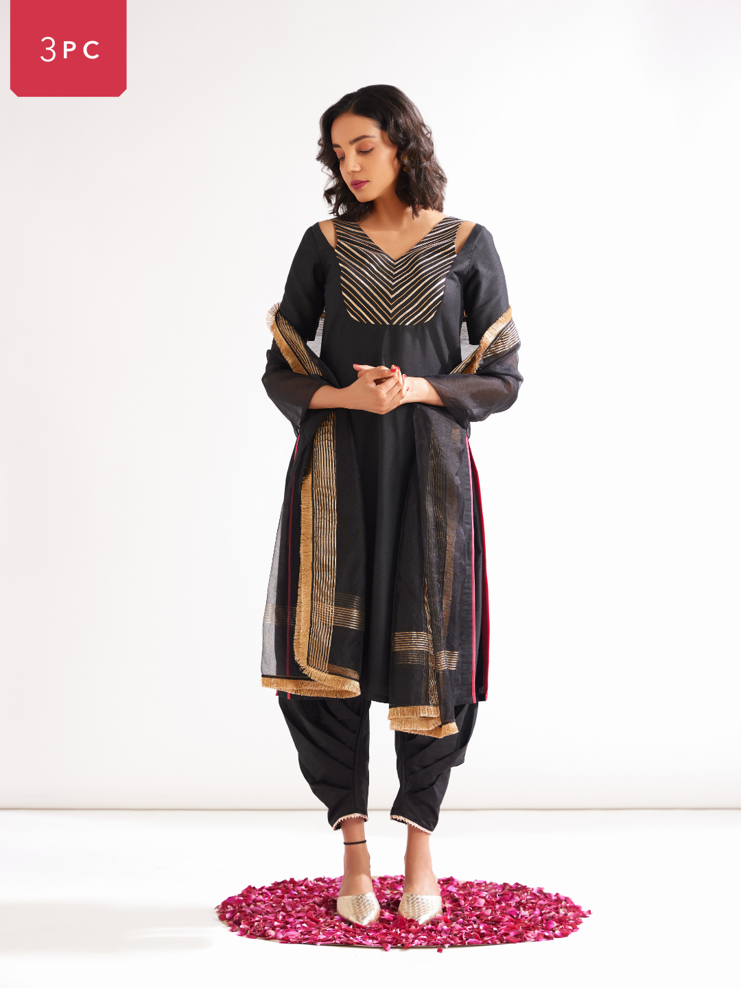 Shoulder cut-out kurta highlighted with gota patti yoke paired with side pleated pants along with dupatta- Rich black