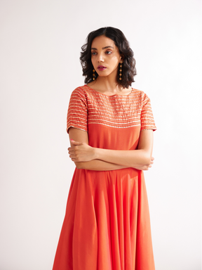 Circular panelled dress highlighted with Gota patti yoke- Spicy Orange