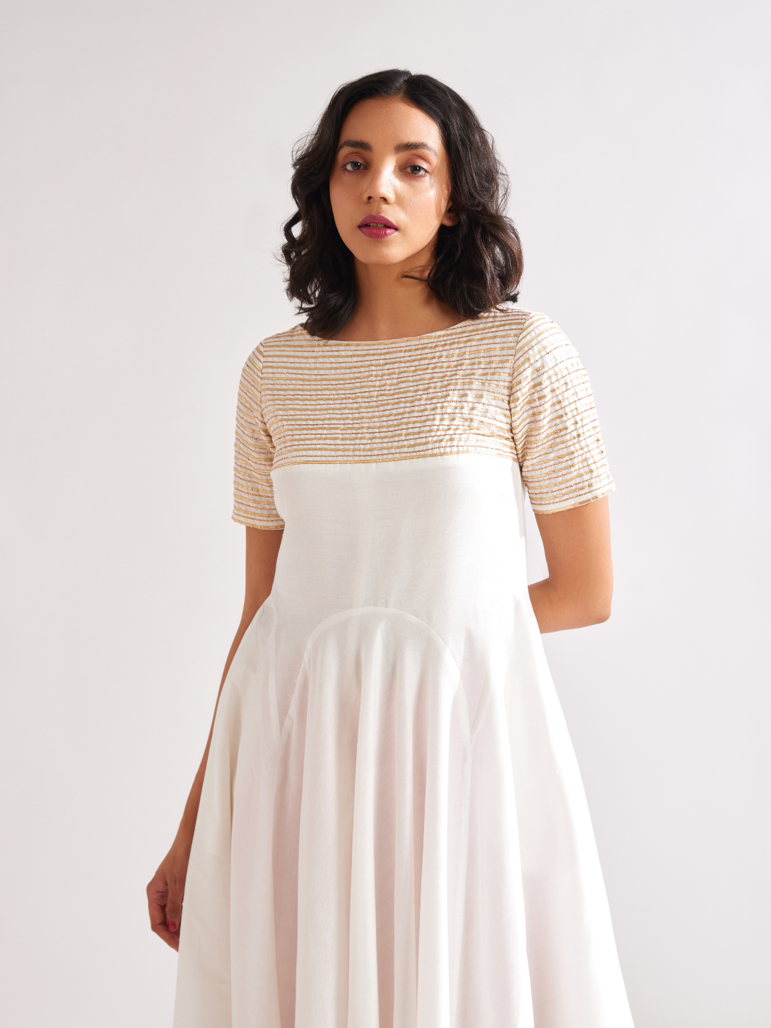 Circular panelled dress highlighted with Gota patti yoke- Ivory