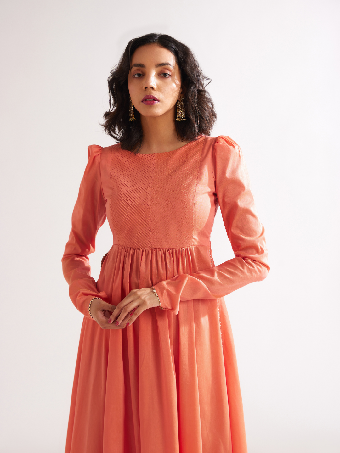 Pintucked yoke flared kurta with churidaar sleeves- Peach Fuzz
