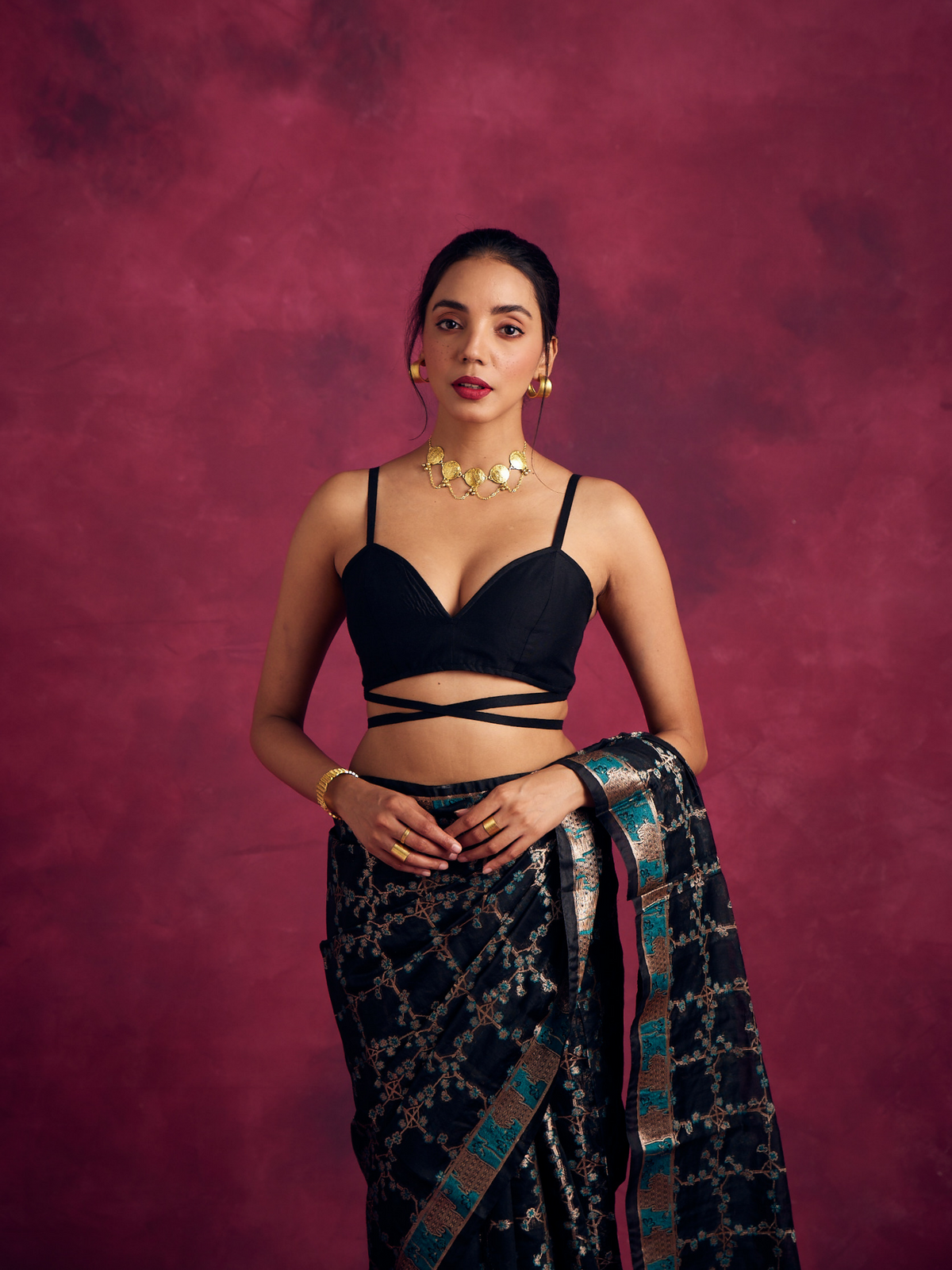 Demi- shaped blouse with
criss cross tie up- Rich black