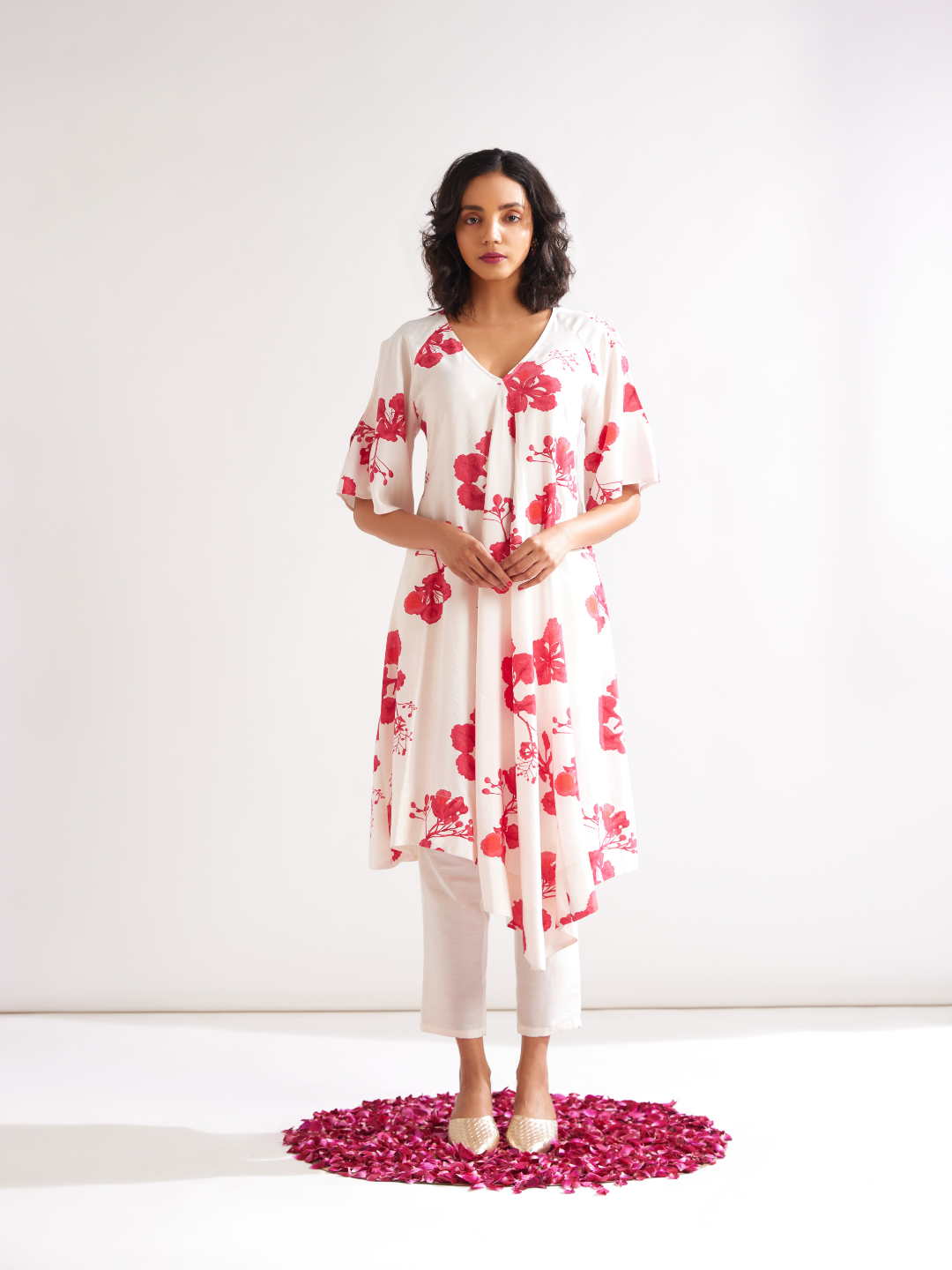 Asymmetrical Gulmohar kurta with cut out sleeves paired with pegged pants along with dupatta- Ivory