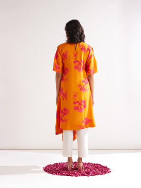 Asymmetrical Gulmohar kurta with cut out sleeves paired with pegged pants along with dupatta- Spicy orange