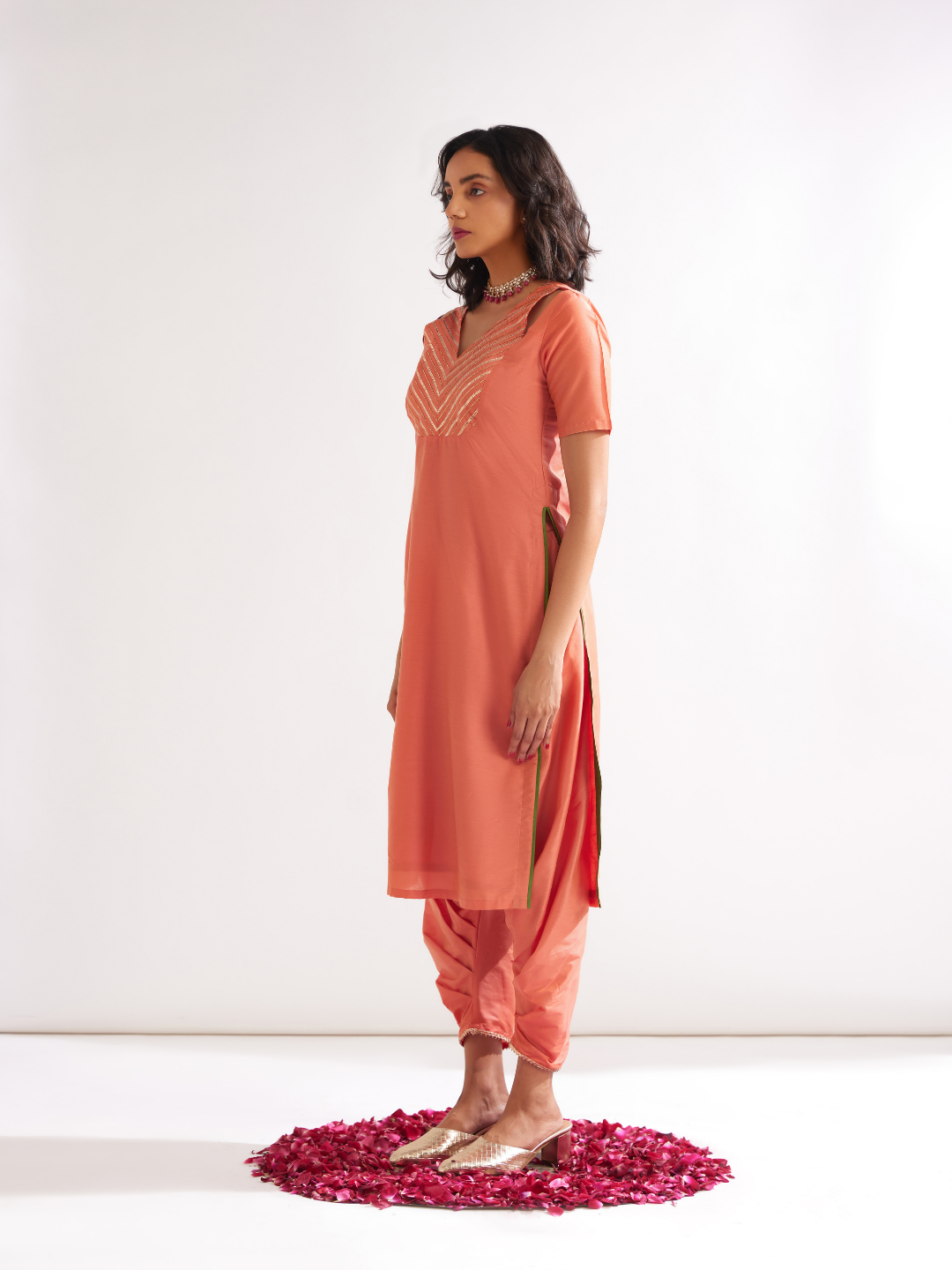 Shoulder cut-out kurta highlighted with gota patti yoke paired with side pleated pants- Peach