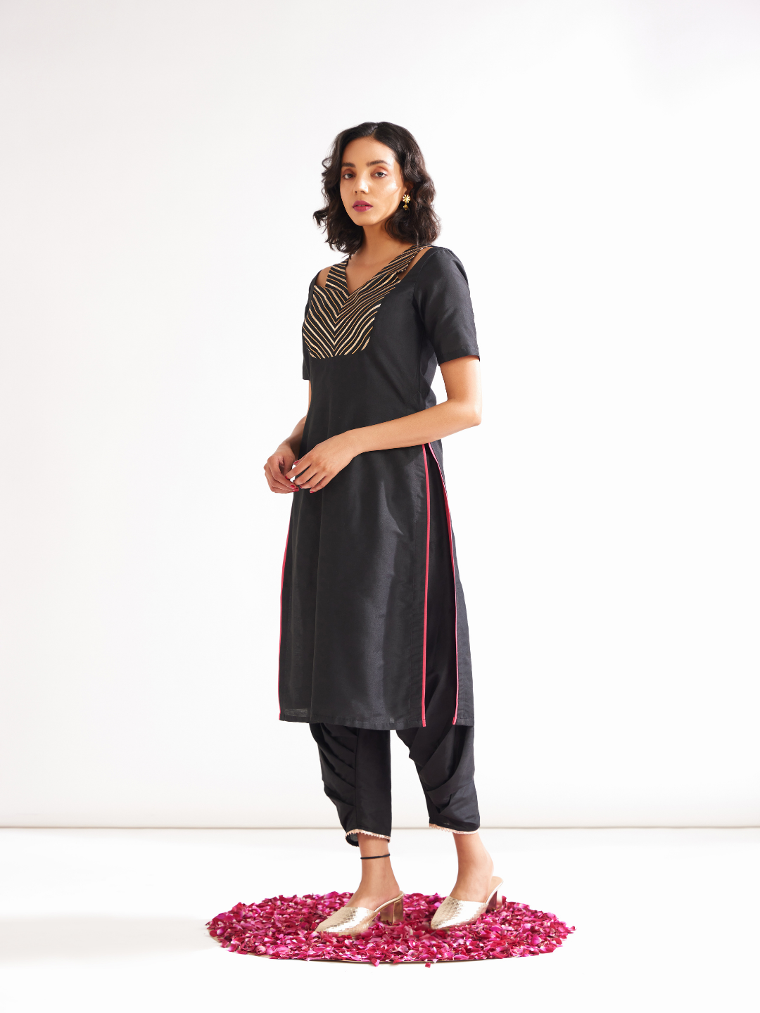 Shoulder cut-out kurta highlighted with gota patti yoke paired with side pleated pants- Rich black