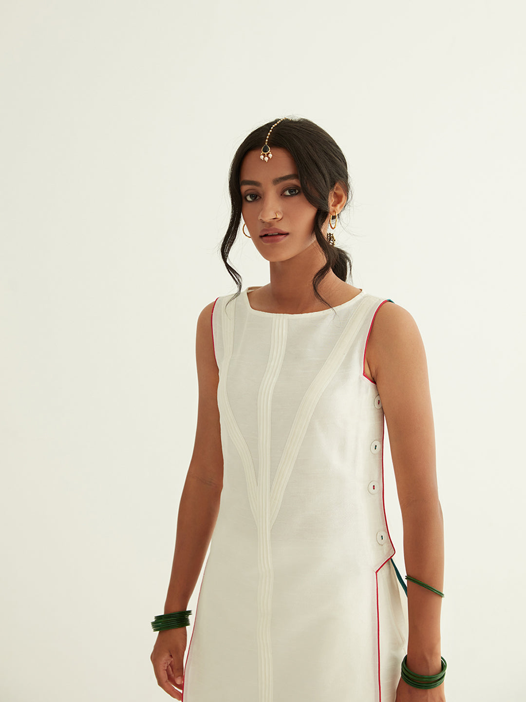 Straight banarasi pintuck kurta paired with pleated pants