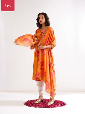 Gulmohar cowl drape straight kurta paired with dhoti pants along with dupatta- Spicy Orange