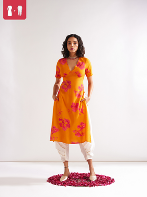 Gulmohar back tie-up kurta Paired with side pleated dhoti- Spicy Orange