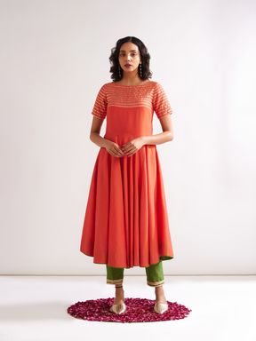 Circular panelled Kurta highlighted with Gota patti yoke paired with pegged pants along with dupatta- Spicy Orange