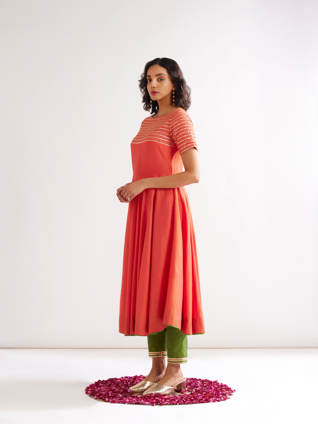 Circular panelled Kurta highlighted with Gota patti yoke paired with pegged pants along with dupatta- Spicy Orange