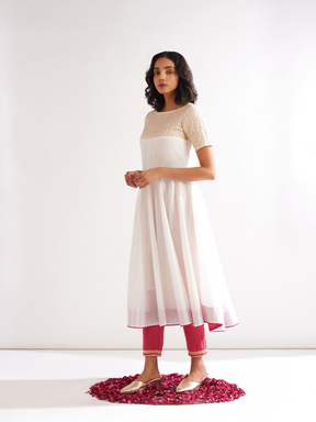 Circular panelled Kurta highlighted with Gota patti yoke paired with pegged pants along with dupatta- Cream