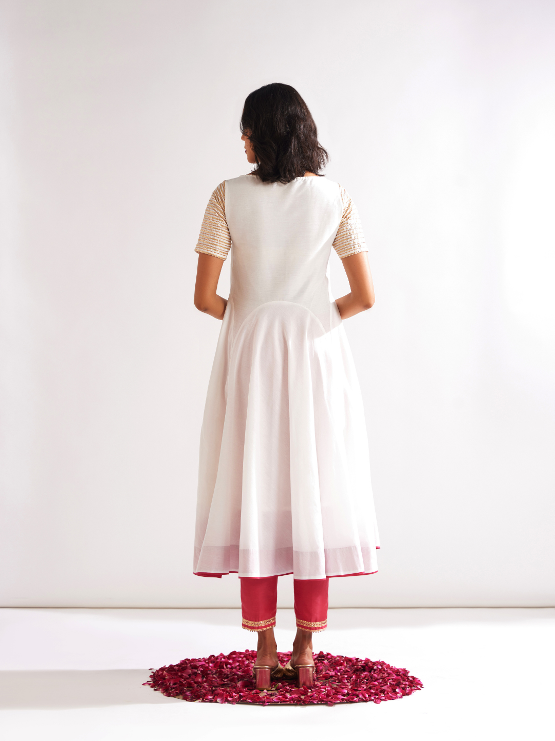 Circular panelled Kurta highlighted with Gota patti yoke paired with pegged pants along with dupatta- Cream