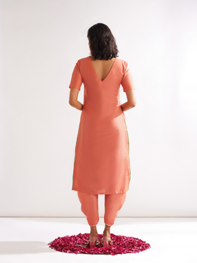Shoulder cut-out kurta highlighted with gota patti yoke paired with side pleated pants along with dupatta- Peach