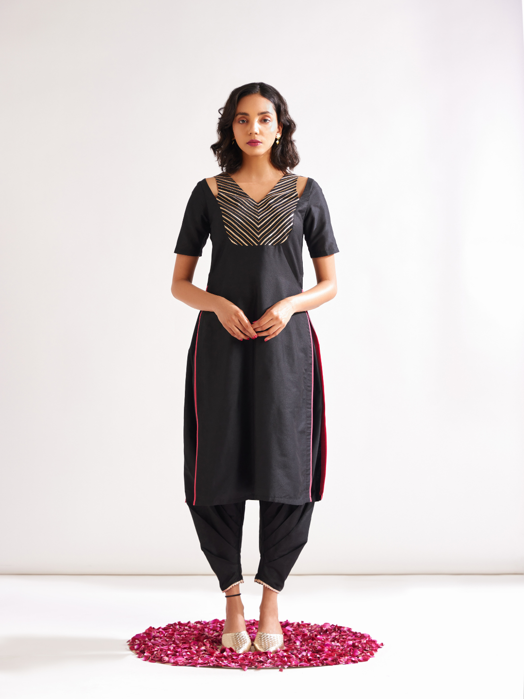Shoulder cut-out kurta highlighted with gota patti yoke paired with side pleated pants along with dupatta- Rich black