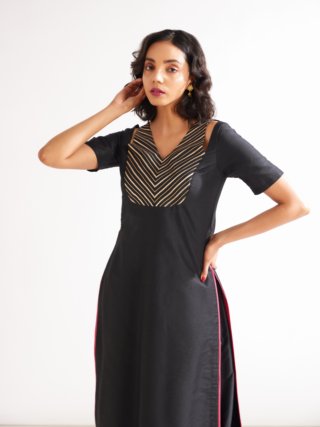 Shoulder cut-out kurta highlighted with gota patti yoke paired with side pleated pants along with dupatta- Rich black