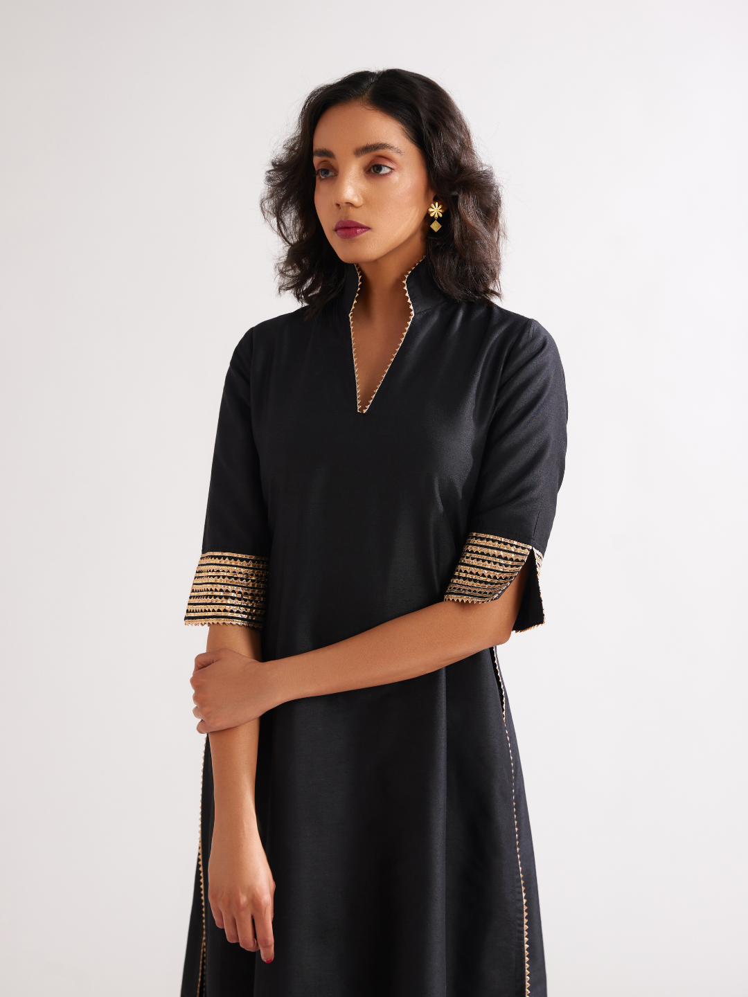Stand collar straight kurta highlighted with gota patti with pegged pants along with dupatta- Rich black