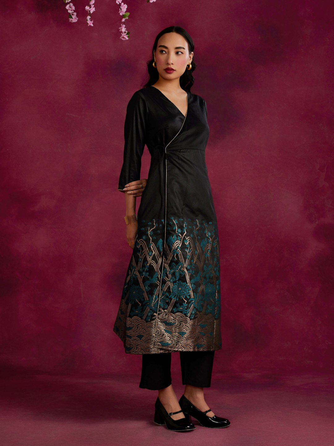 Angrakha kurta with zari work hem paired with straight pants- Black