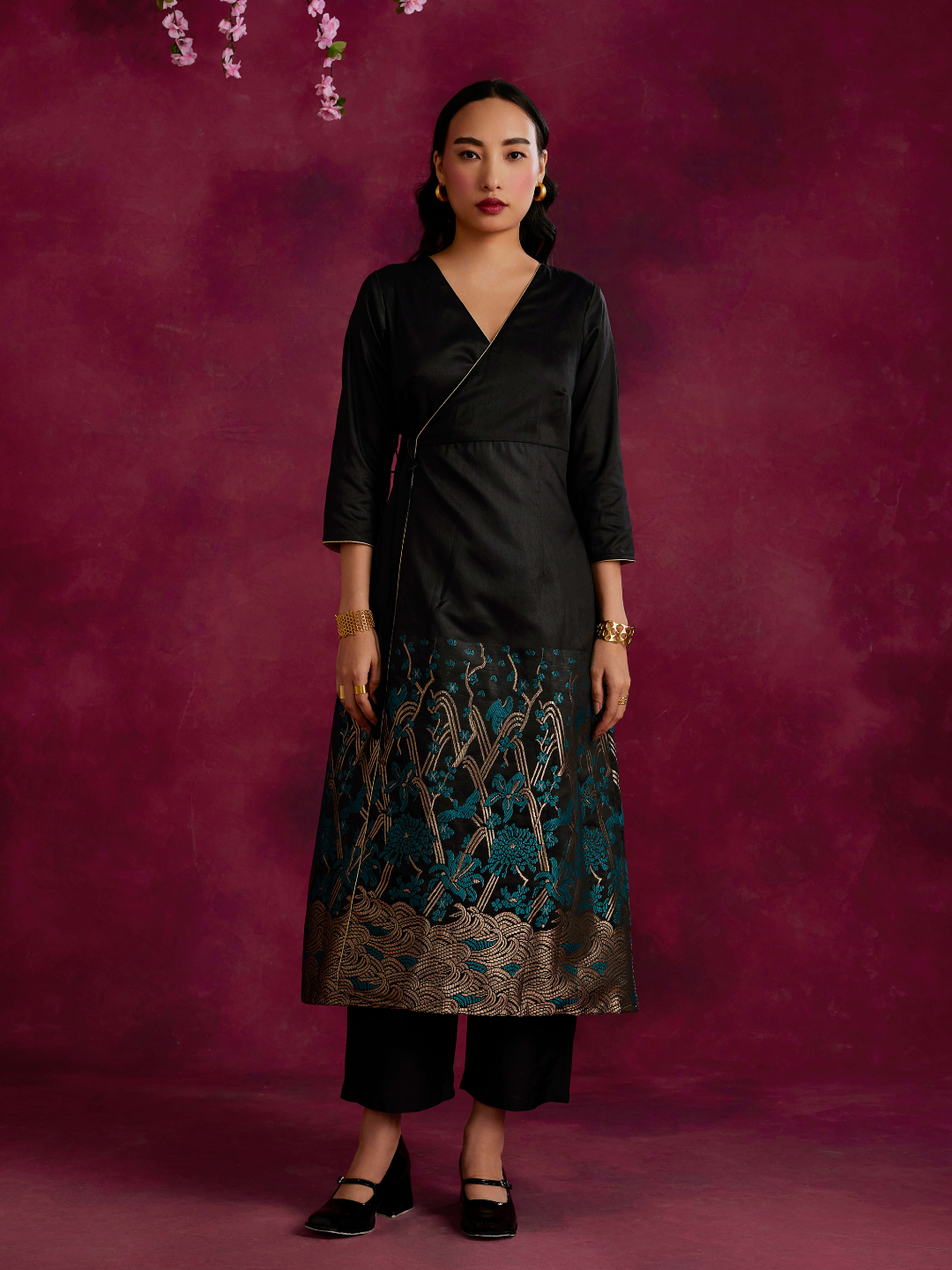 Angrakha kurta with zari work hem paired with straight pants- Black