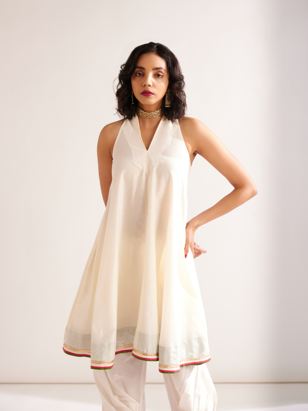 Back overlap halter neck kurta paired with side pleated pants- Ivory