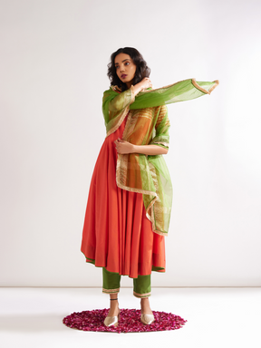 Circular panelled Kurta highlighted with Gota patti yoke paired with pegged pants- Spicy Orange