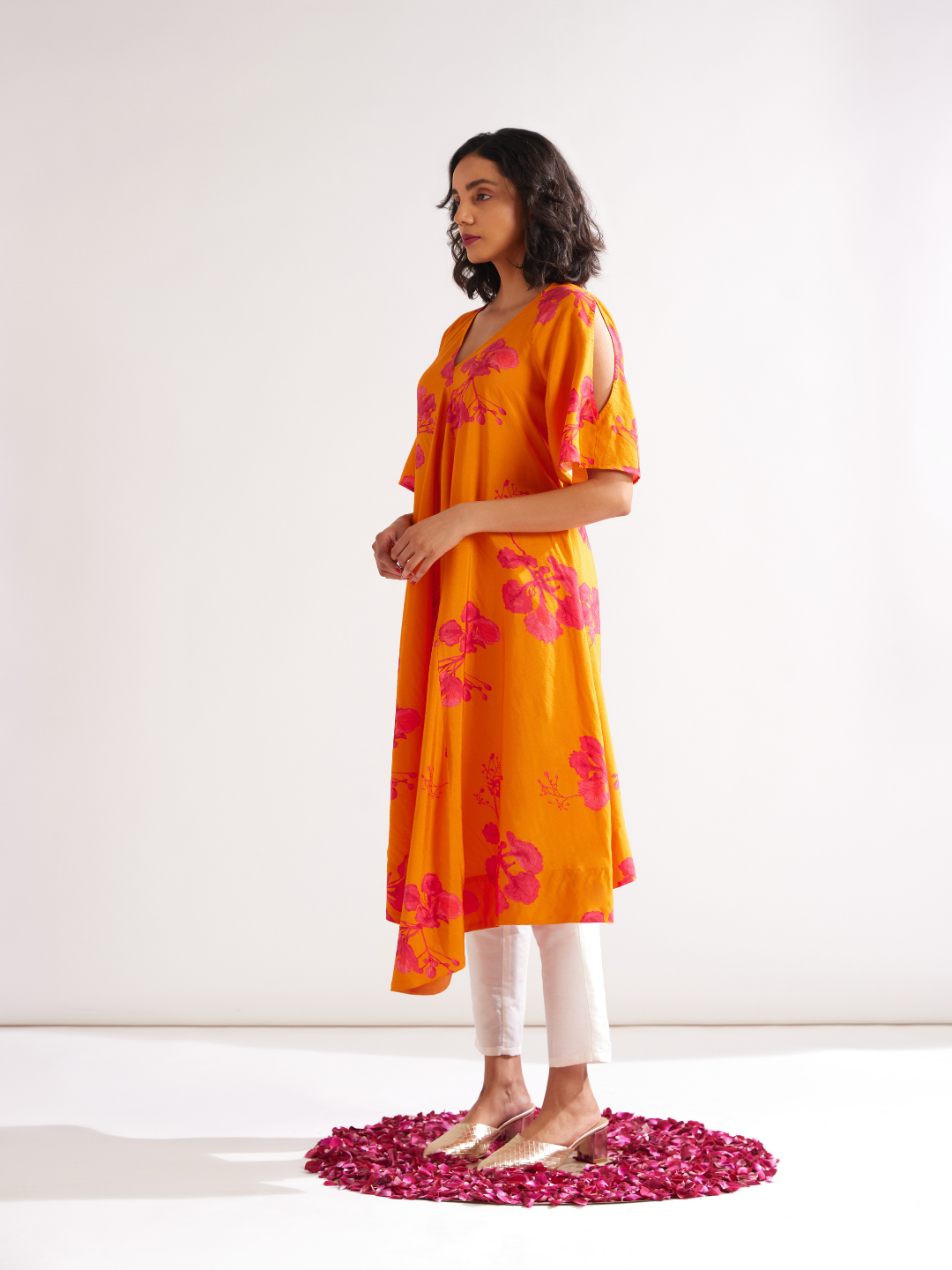 Asymmetrical Gulmohar kurta with cut out sleeves paired with pegged pants- Spicy orange