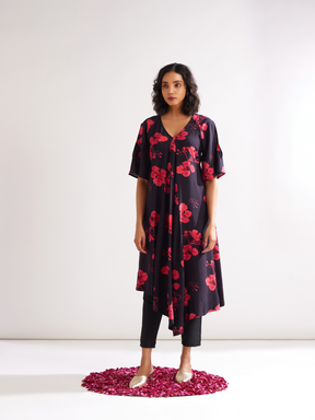 Asymmetrical Gulmohar kurta with cut out sleeves paired with pegged pants- Rich black