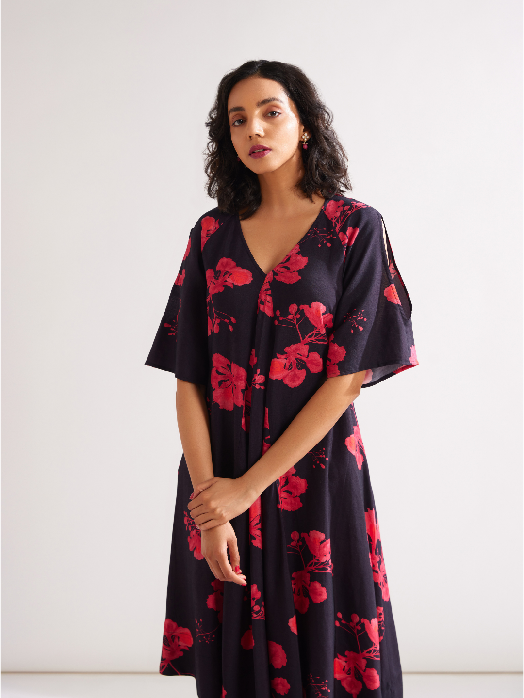 Asymmetrical Gulmohar kurta with cut out sleeves paired with pegged pants- Rich black