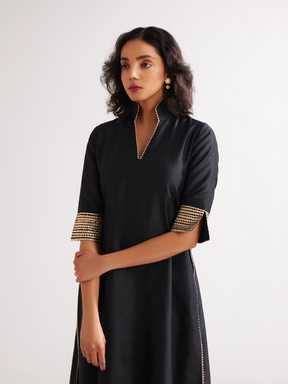 Stand collar straight kurta highlighted with gota patti with pegged pants- Rich black