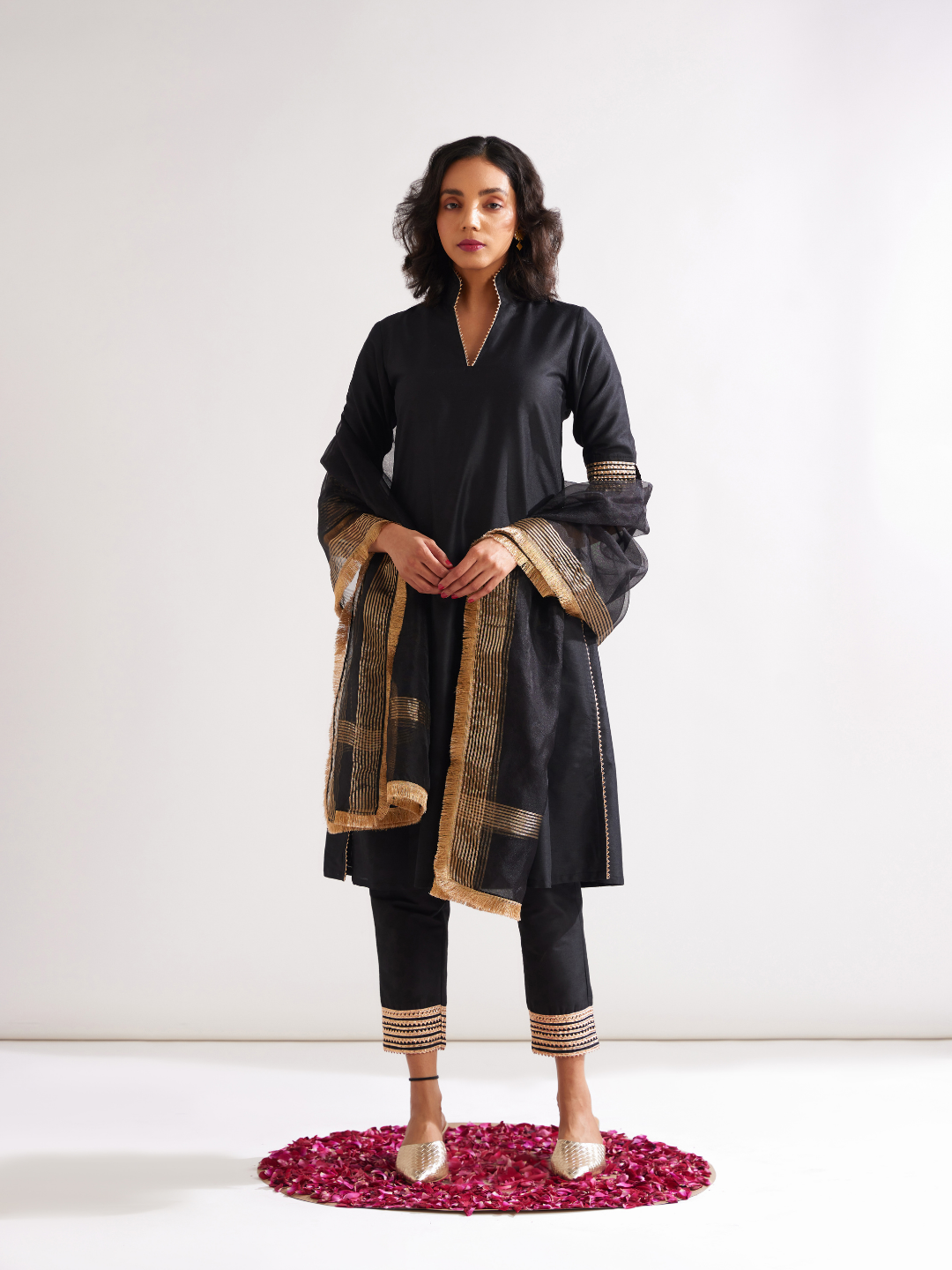 Stand collar straight kurta highlighted with gota patti with pegged pants- Rich black