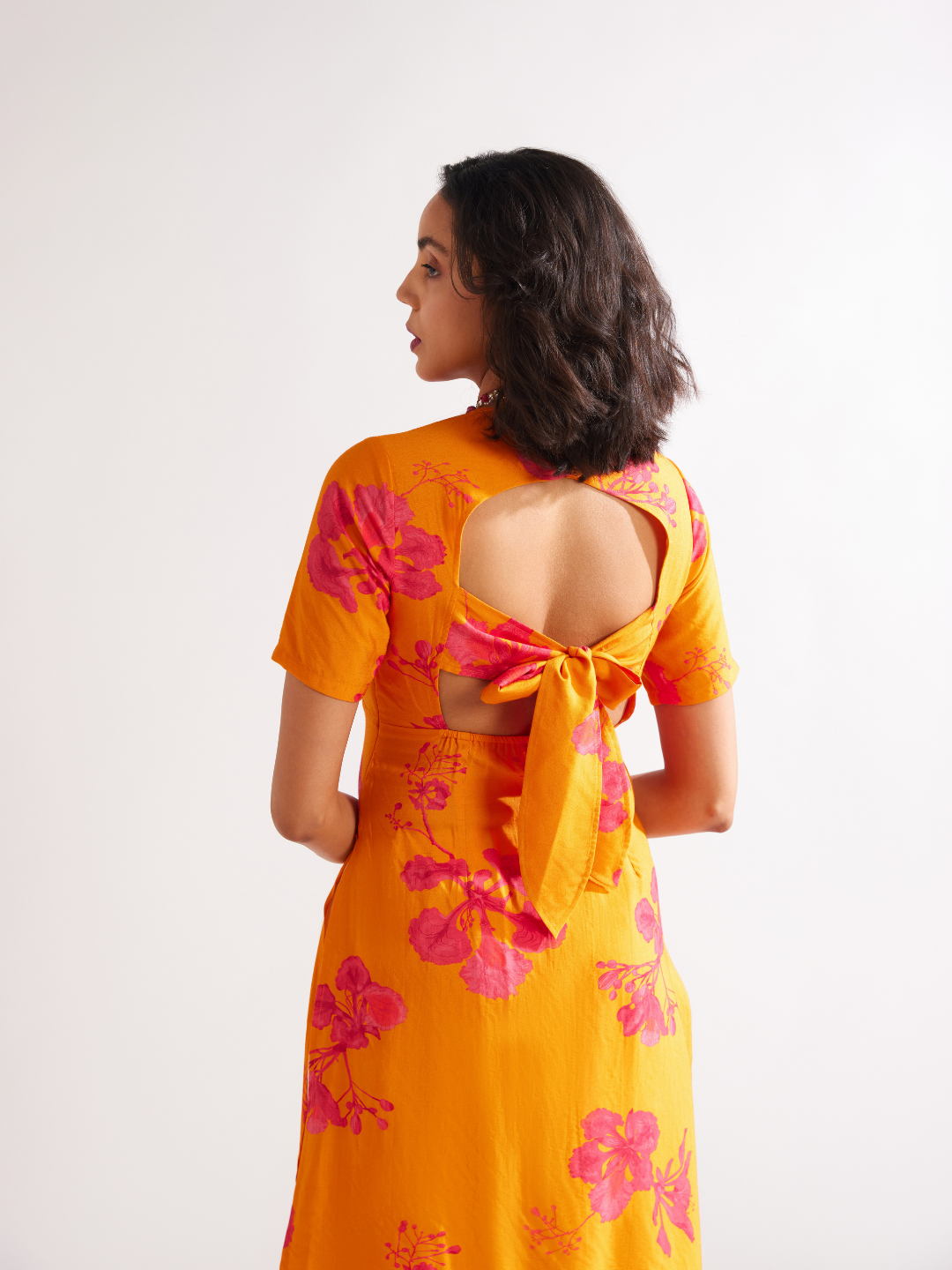 Gulmohar back tie-up kurta Paired with side pleated dhoti- Spicy Orange