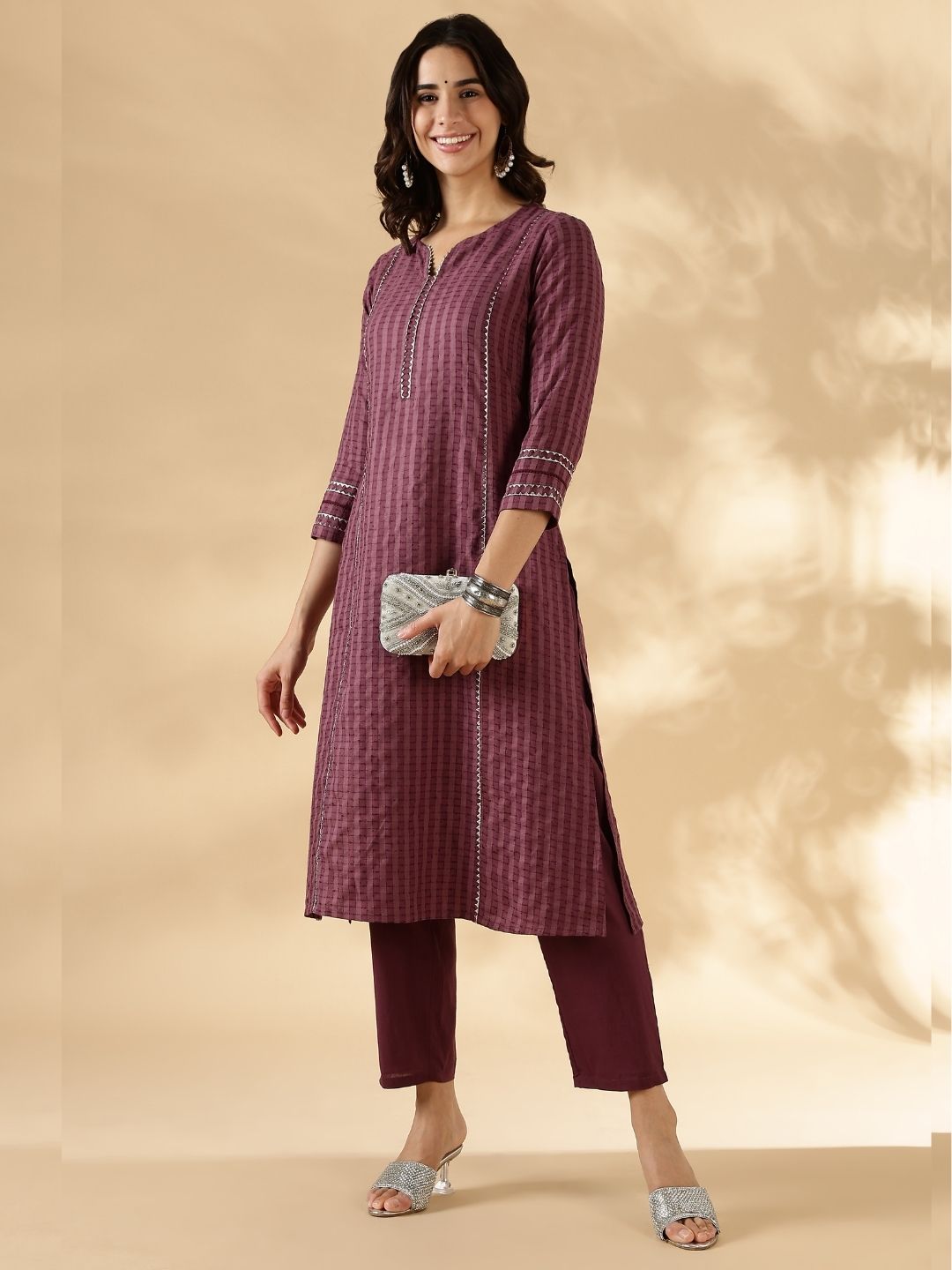 Textured kurta with delicate lace detail on the neck, shoulder princess and sleeves with solid pant