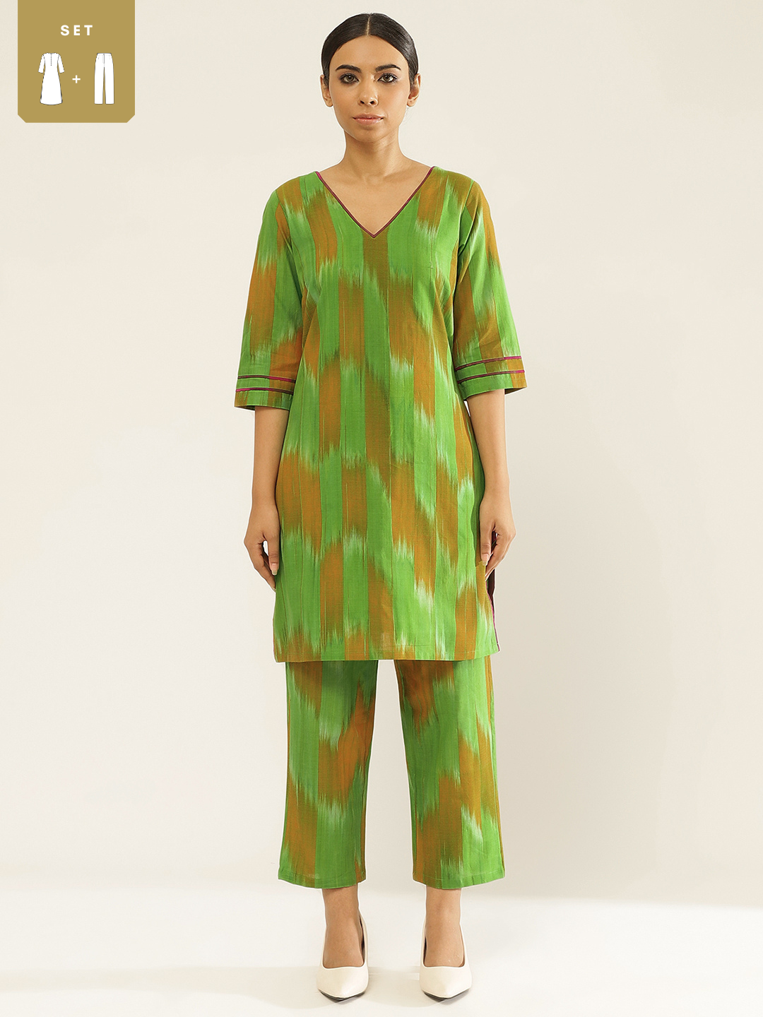 Ikat cotton kurta with contrast detailing paired with Ikat cotton straight pants.