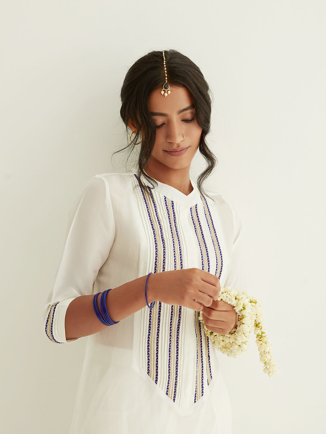 Straight banarasi kurta with a highlighted long placket with tulip pants