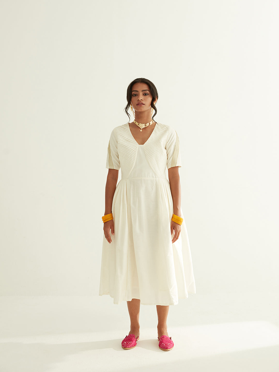 Pleated front dress with lace highlights on sleeves