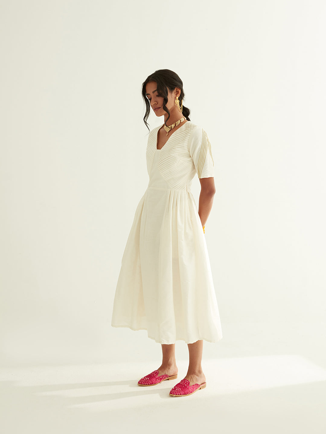 Pleated front dress with lace highlights on sleeves