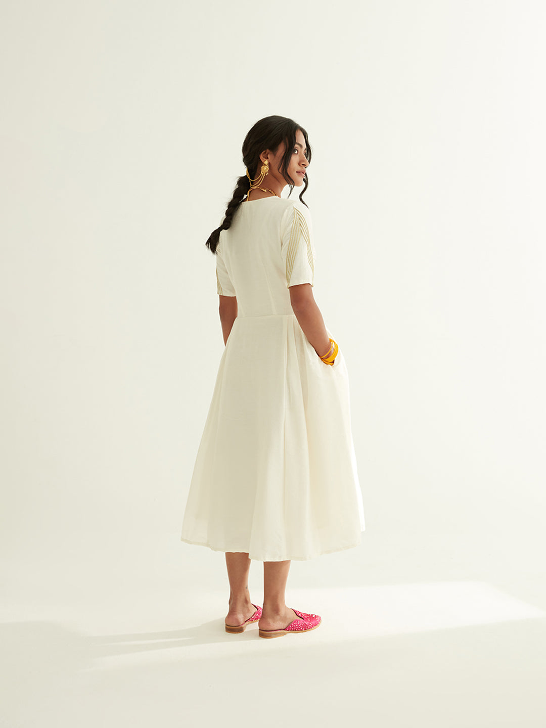 Pleated front dress with lace highlights on sleeves