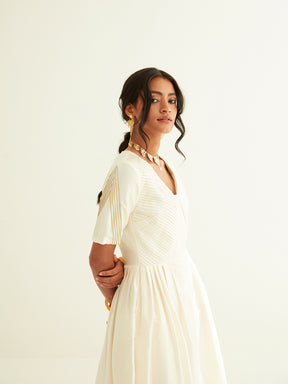 Pleated front dress with lace highlights on sleeves