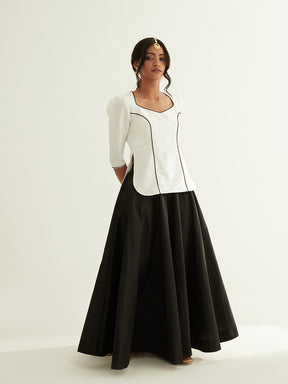 Short kurti with pointed U-neck paired with circular skirt