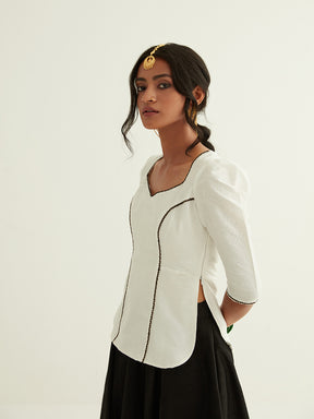 Short kurti with pointed U-neck paired with circular skirt