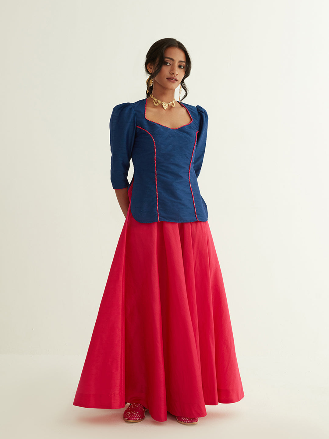 Short kurti with pointed U-neck paired with circular skirt