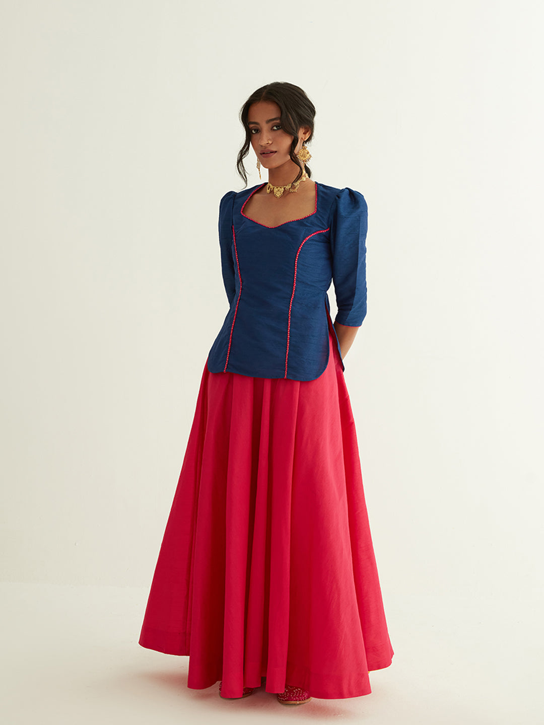 Short kurti with pointed U-neck paired with circular skirt