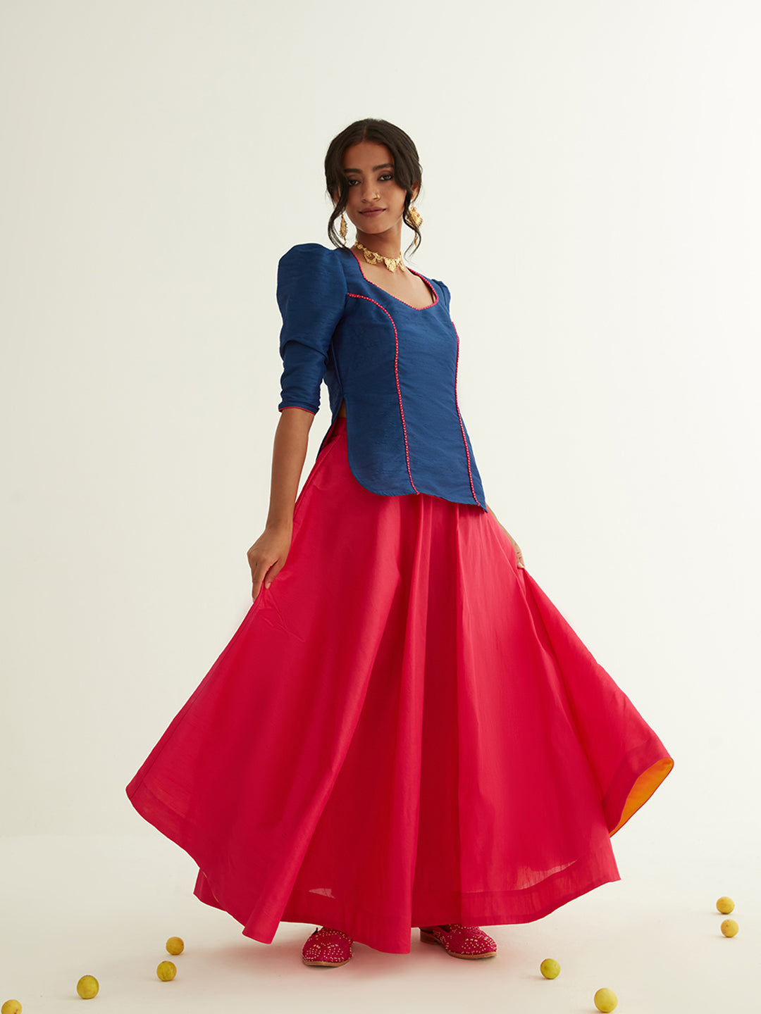 Short kurti with pointed U-neck paired with circular skirt