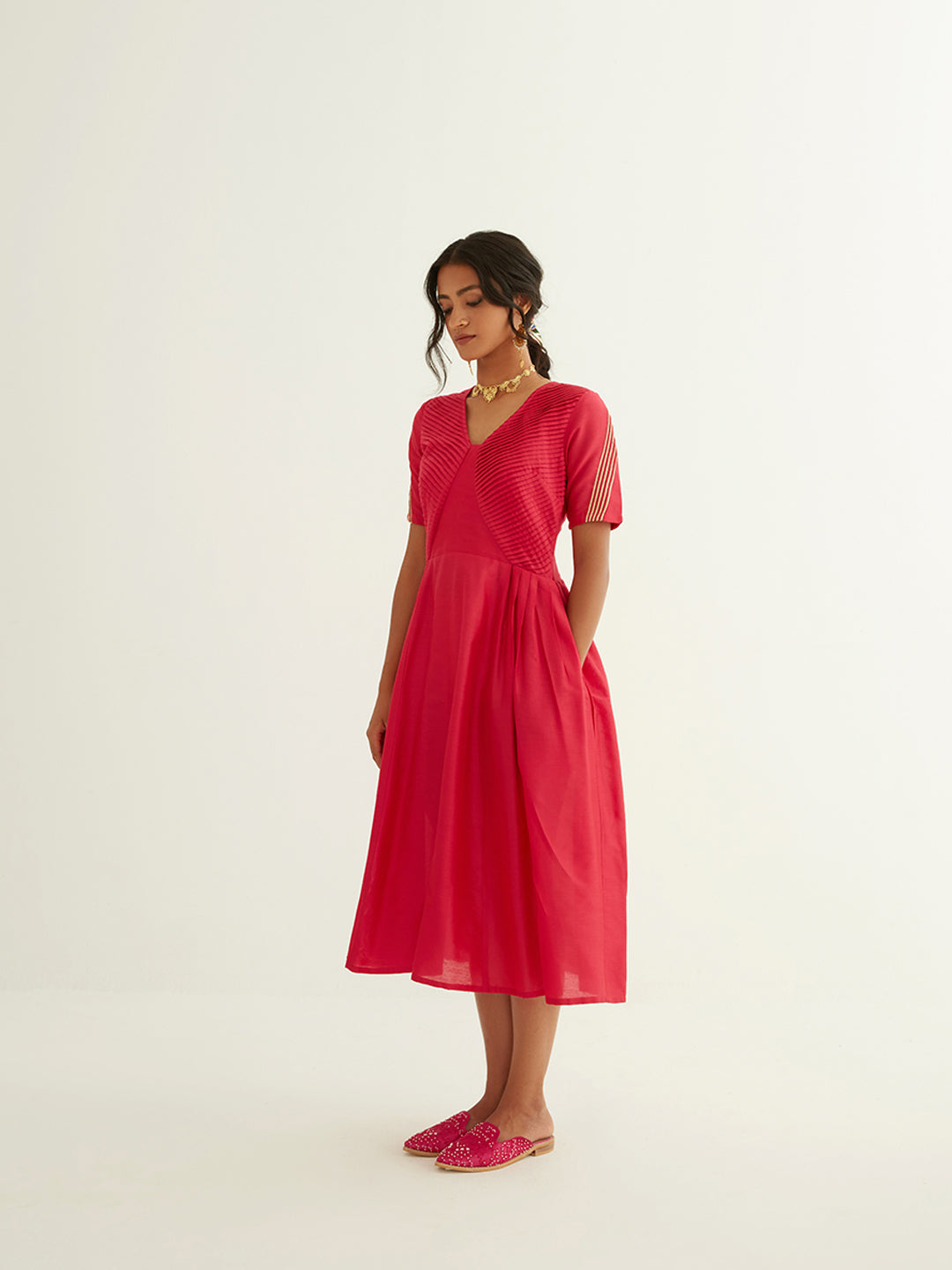 Pleated front dress with lace highlights on sleeves