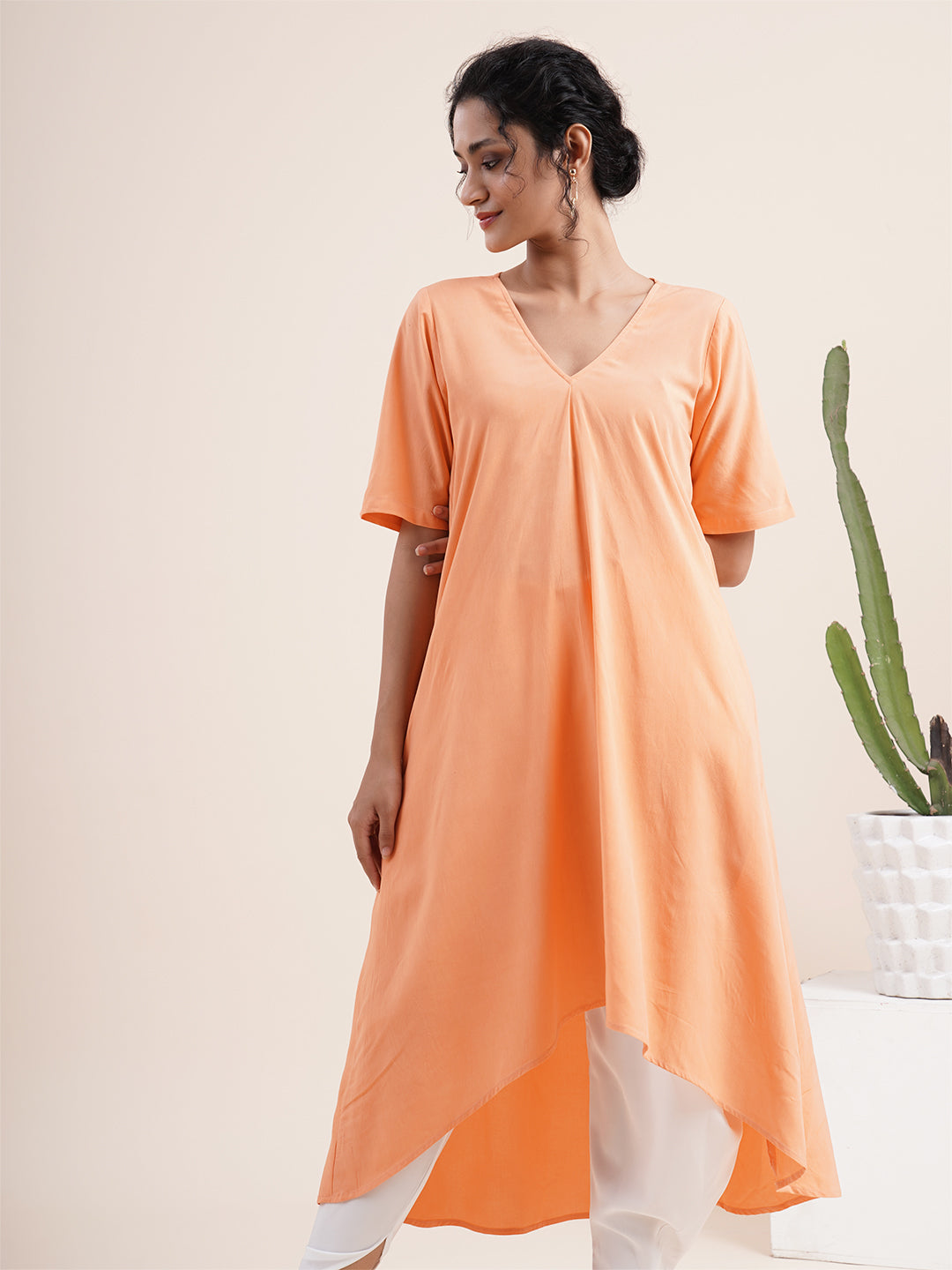Peach Kurta with pleat sewn from neckline
