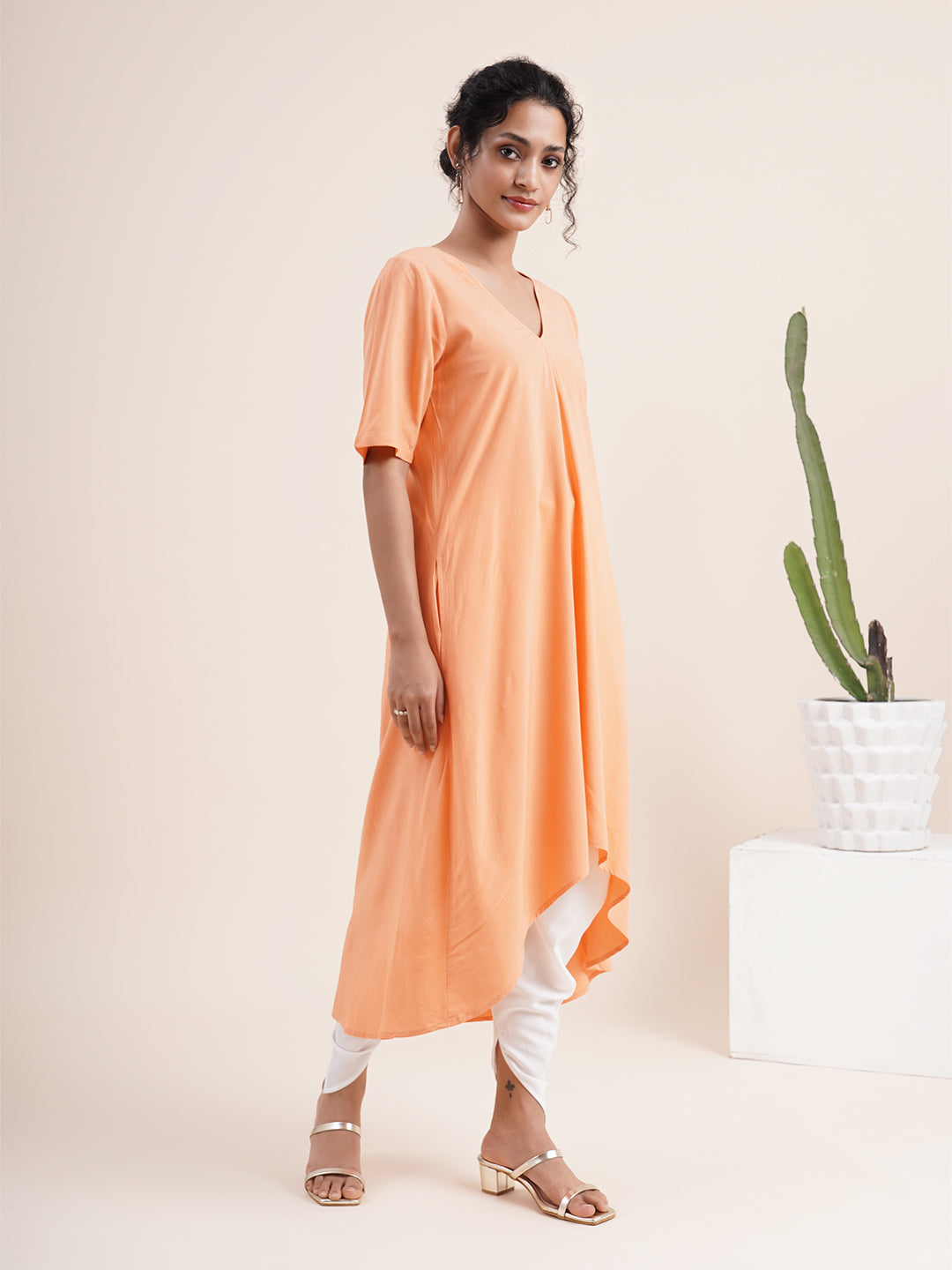 Peach Kurta with pleat sewn from neckline