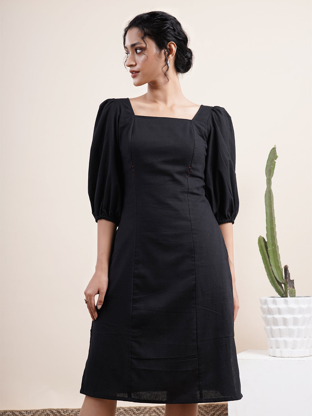 Black square neck dress with bishop sleeves