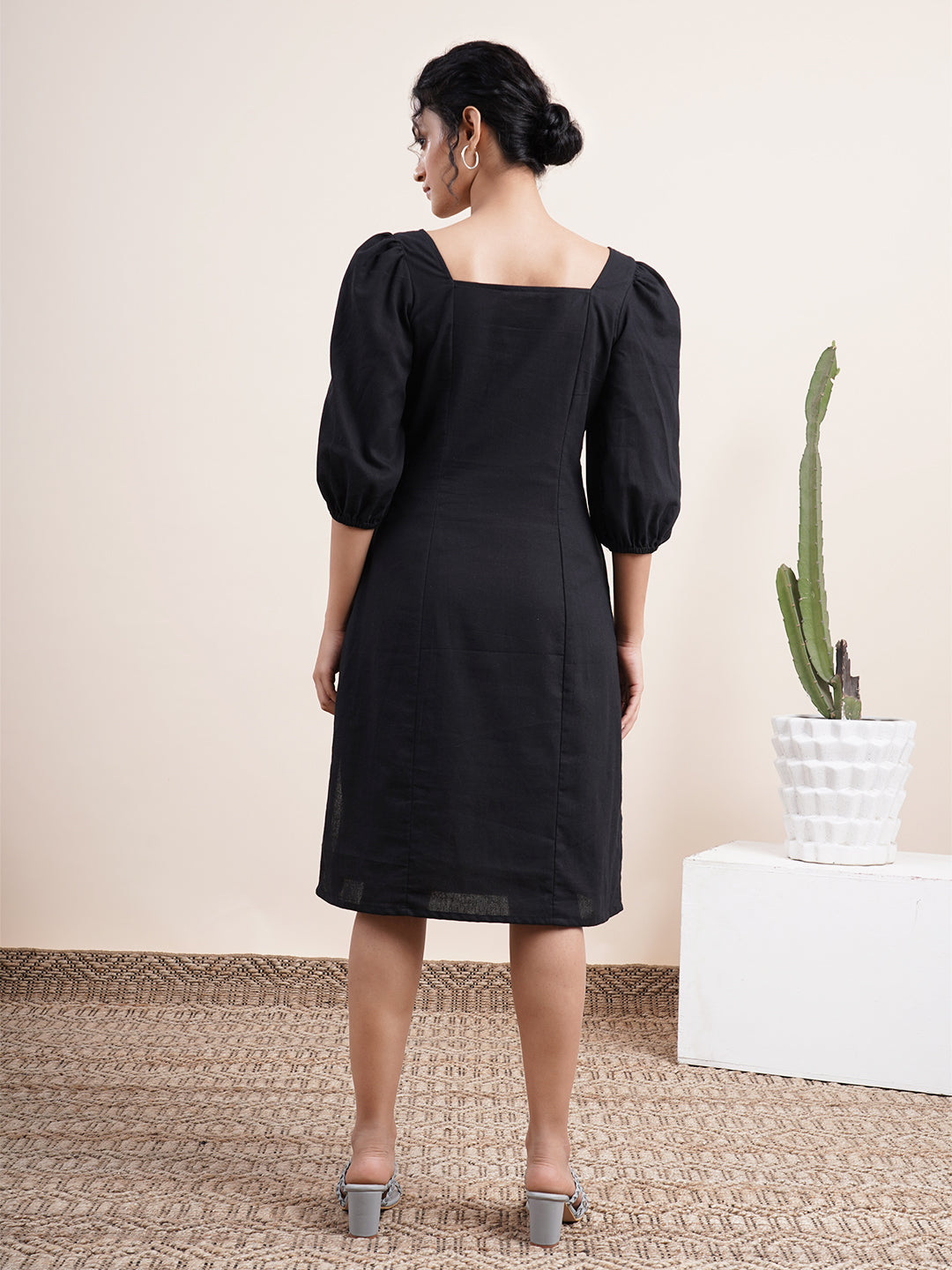 Black square neck dress with bishop sleeves