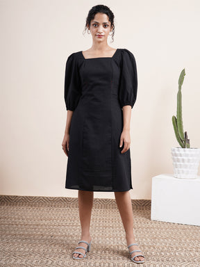 Black square neck dress with bishop sleeves