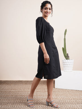 Black square neck dress with bishop sleeves
